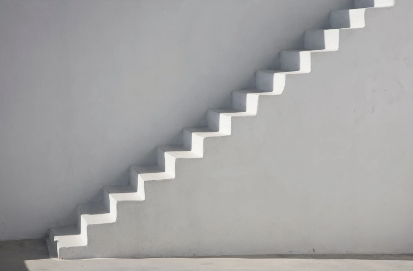 white cement steps leading up to the right